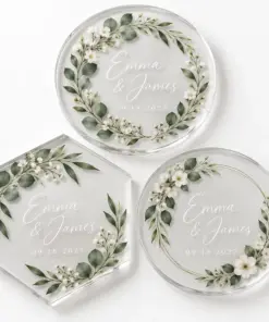 Clear acrylic coasters with botanical wedding artwork printed on the surface