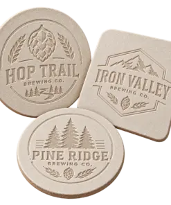 Brewery debossed coasters with custom brewery logo samples on a transparent background